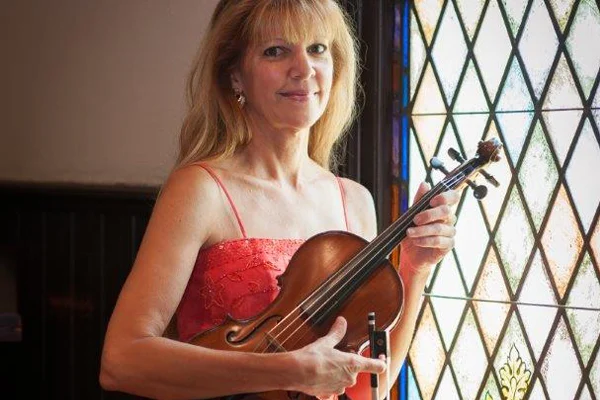 Christine with violin near window